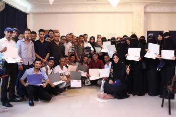 A large group of Nahdhat Shabab graduates pose with their certificates