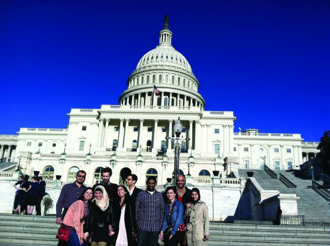 A group of Moroccans posing for a group photo outside the United States Capitol  in Washington D.C. 