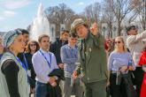 A park ranger talks to students at the World War 2 memorial in Washington D.C.